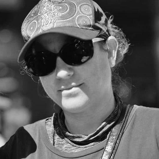 A black and white photograph of a woman with sunglasses