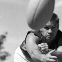 Polly Farmer, with football. Black and white.