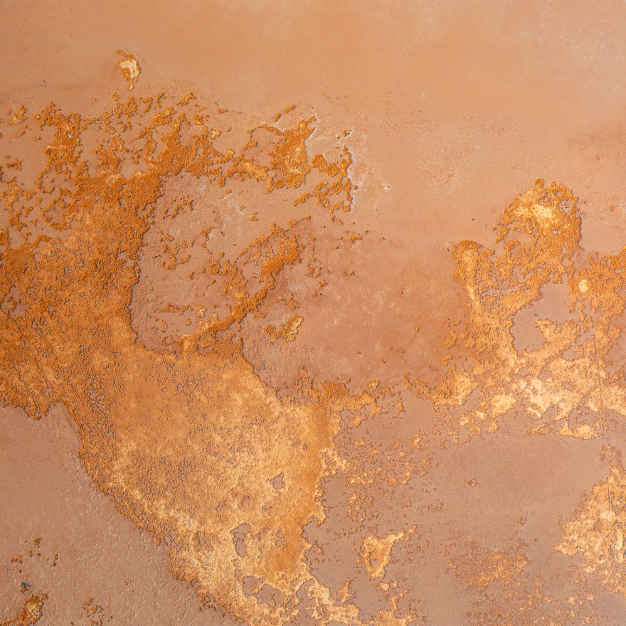 An aerial view of a rocky golden landscape