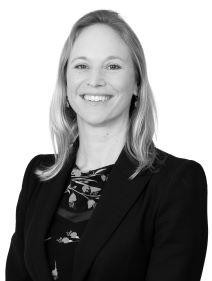 Image of a woman with blonde shoulder length hair wearing a dark blazer.