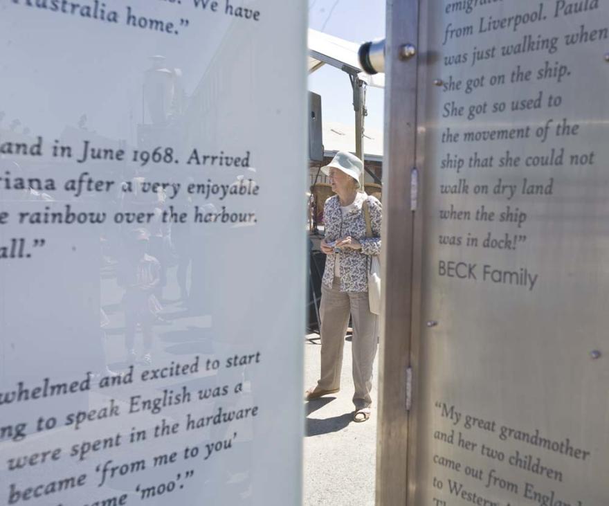 An individual is visible through two engraved glass panels.