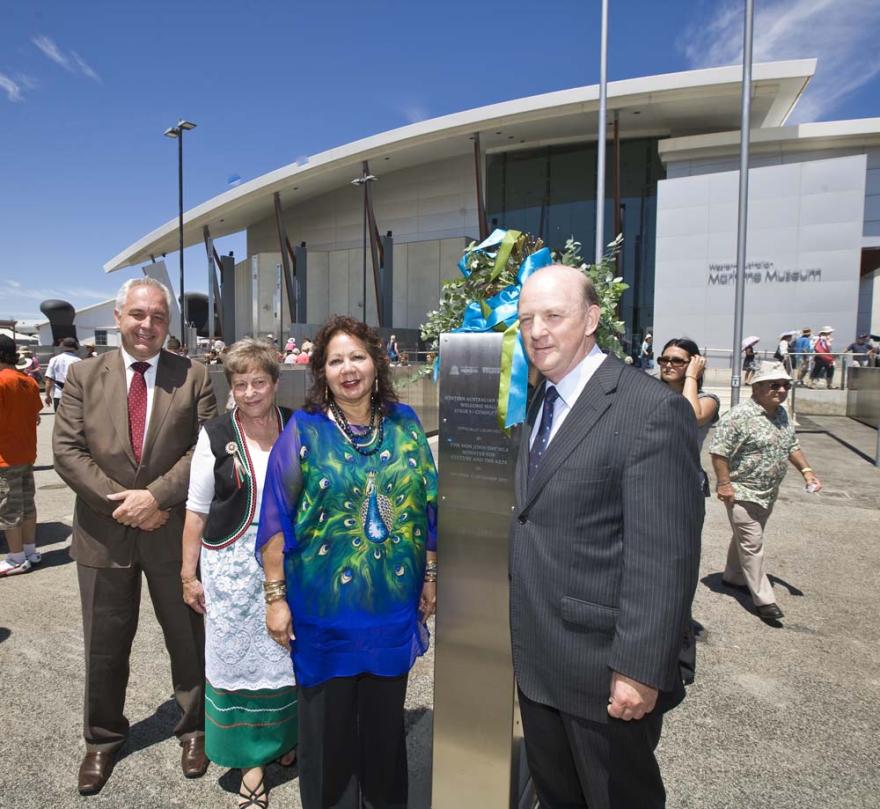 Four individuals interact in front of the Western Australian Maritime Museum.
