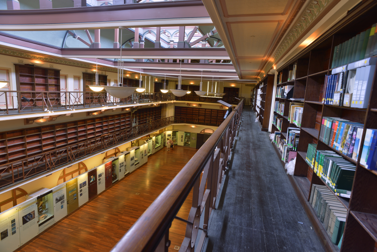 View of a gallery space from a second floor balcony