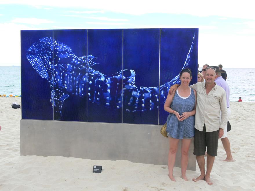 Installing a glass sculpture at a beach for display