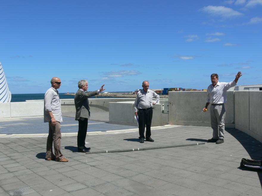 People installing a glass sculpture at the WA Maritime Museum