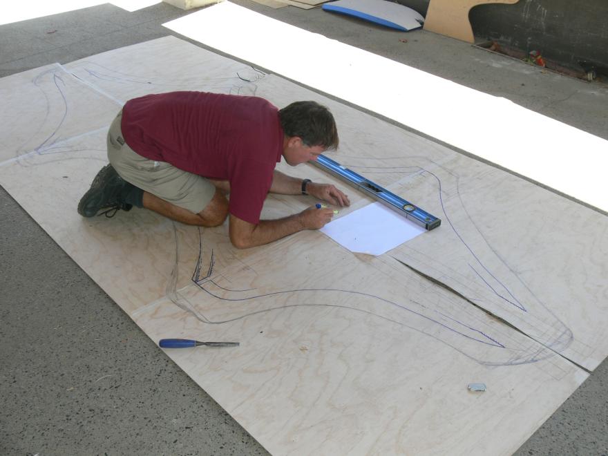 People installing a glass sculpture at the WA Maritime Museum