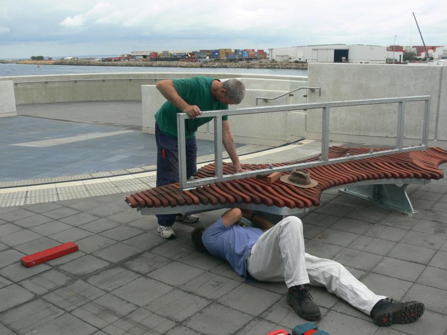 People installing a glass sculpture at the WA Maritime Museum