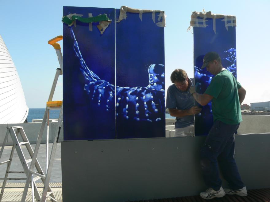 People installing a glass sculpture at the WA Maritime Museum