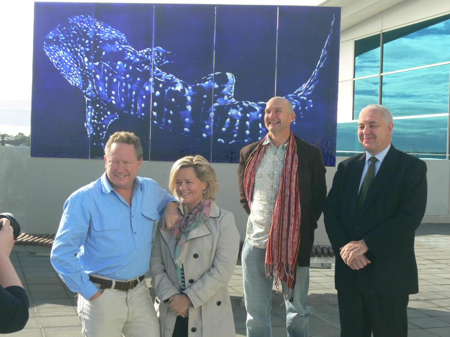 People standing with a glass sculpture at the WA Maritime Museum