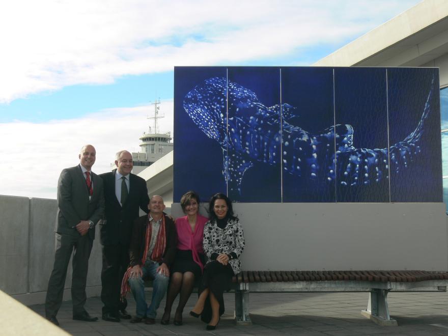 People standing with a glass sculpture at the WA Maritime Museum