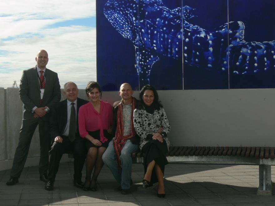 People standing with a glass sculpture at the WA Maritime Museum