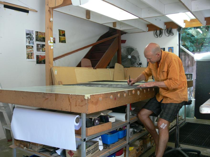 A person building the sculpture "Transparent Sea" in a glass workshop