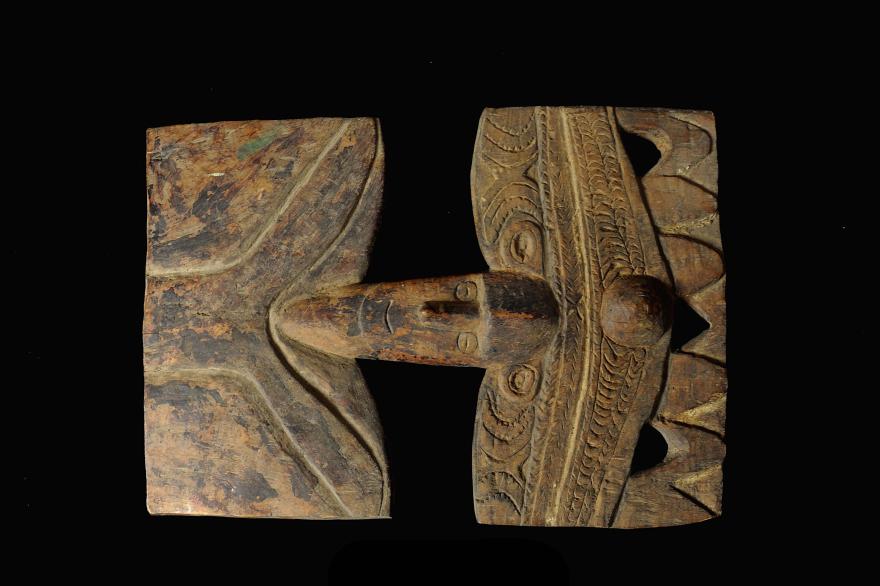 Traditional wooden tribal carving, a Hard wood plaque from the Middle Sepik region, with symmetrical design.
