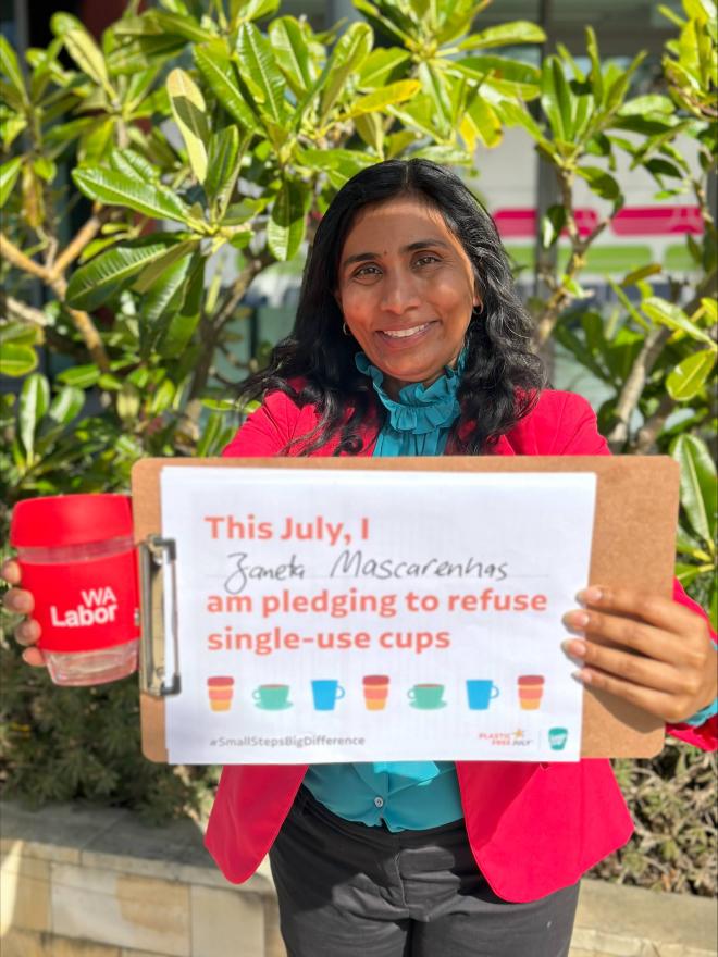 Person holding up a Plastic Free July pledge