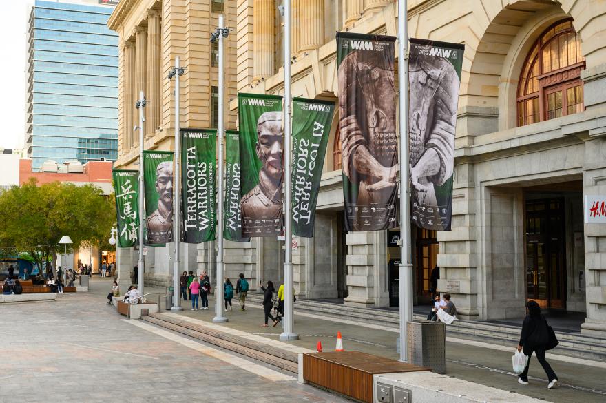 Banners advertising Terracotta Warriors flying in front of a building