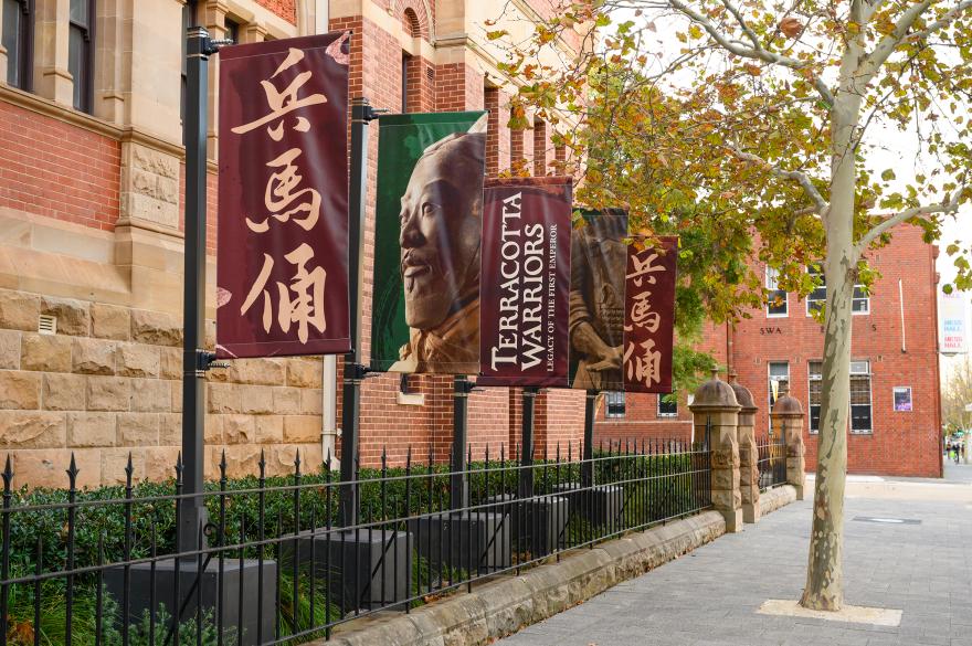 Banners advertising Terracotta Warriors flying in front of a building