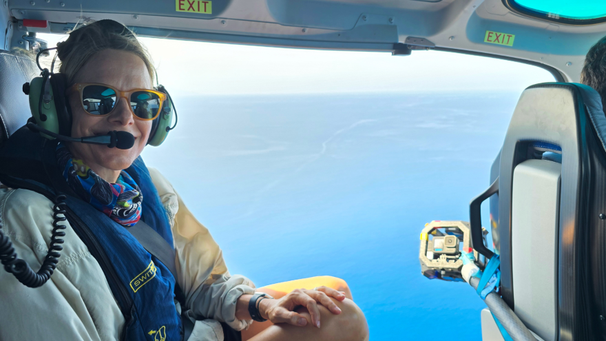 Film crew in helicopter 