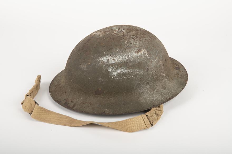 An aged metal army helmet