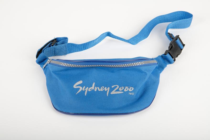A blue bum bag with grey text reading 2000 Sydney Olympics