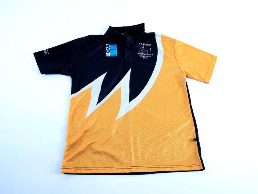 A short sleeved shirt in yellow and navy blue, with sponsorship from The Court