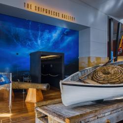 A museum gallery displaying various boating related objects