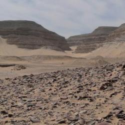 Umm el Qaab in Egypt, a desert environment with low hills in the background