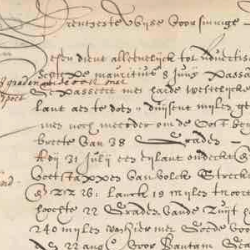Close-up of an aged handwritten historical manuscript with faded ink, dense cursive text, and visible wear on parchment.