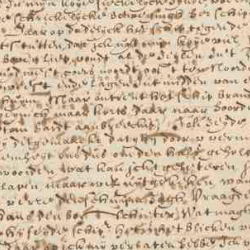 Close-up of an aged handwritten historical manuscript with faded ink, dense cursive text, and visible wear on parchment.