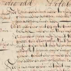 Close-up of an aged handwritten historical manuscript with faded ink, dense cursive text, and visible wear on parchment.