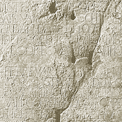 Close up image of a pewter plate with words inscribed into its surface