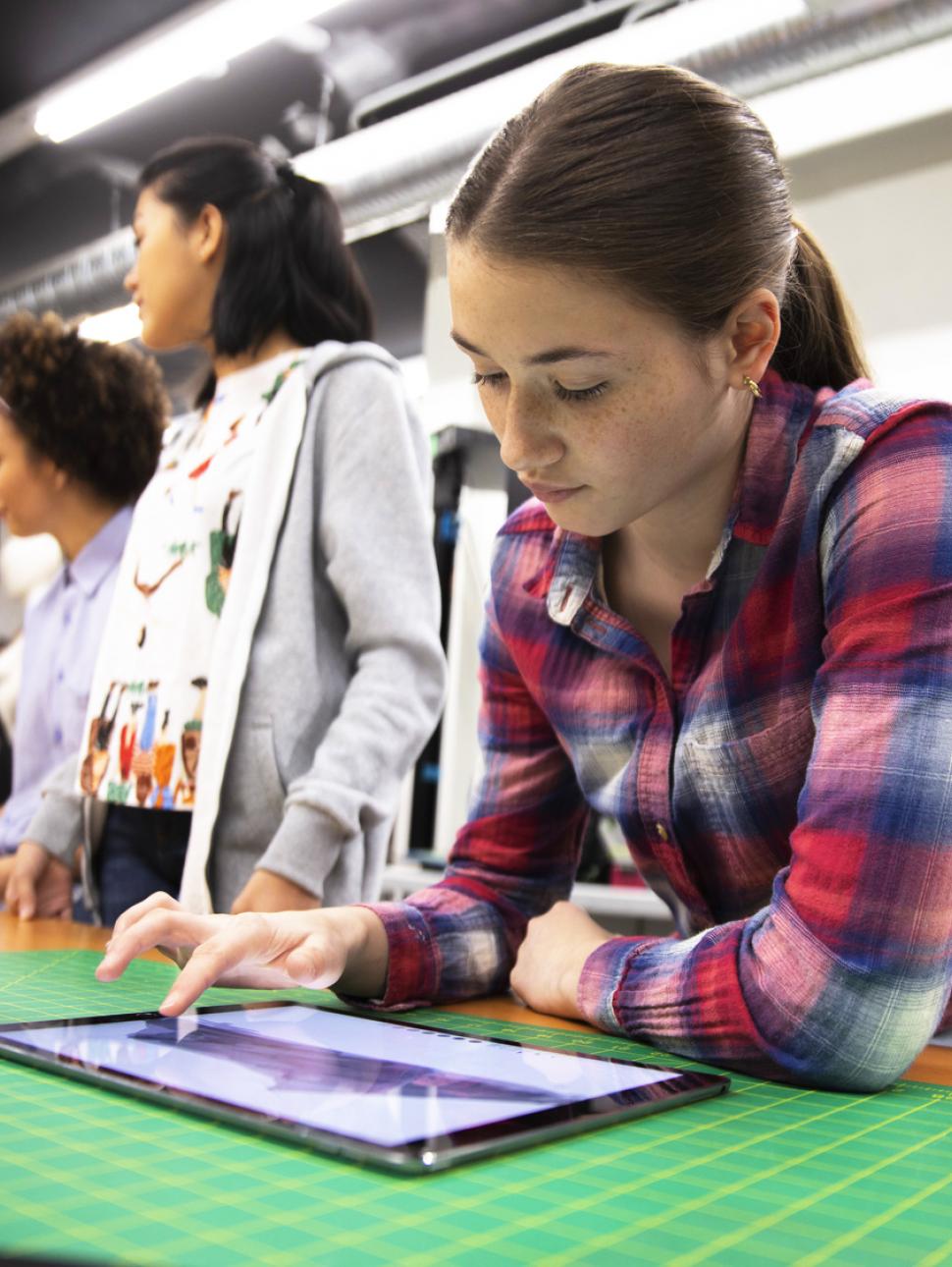 A young woman working on an ipad