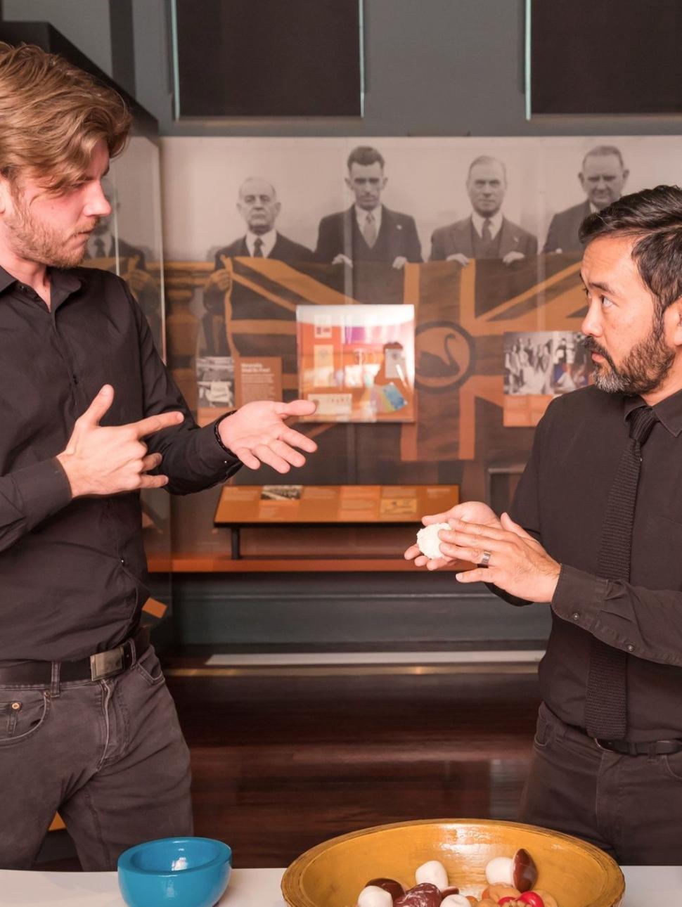 Two AUSLAN interpreters in the Reflections gallery