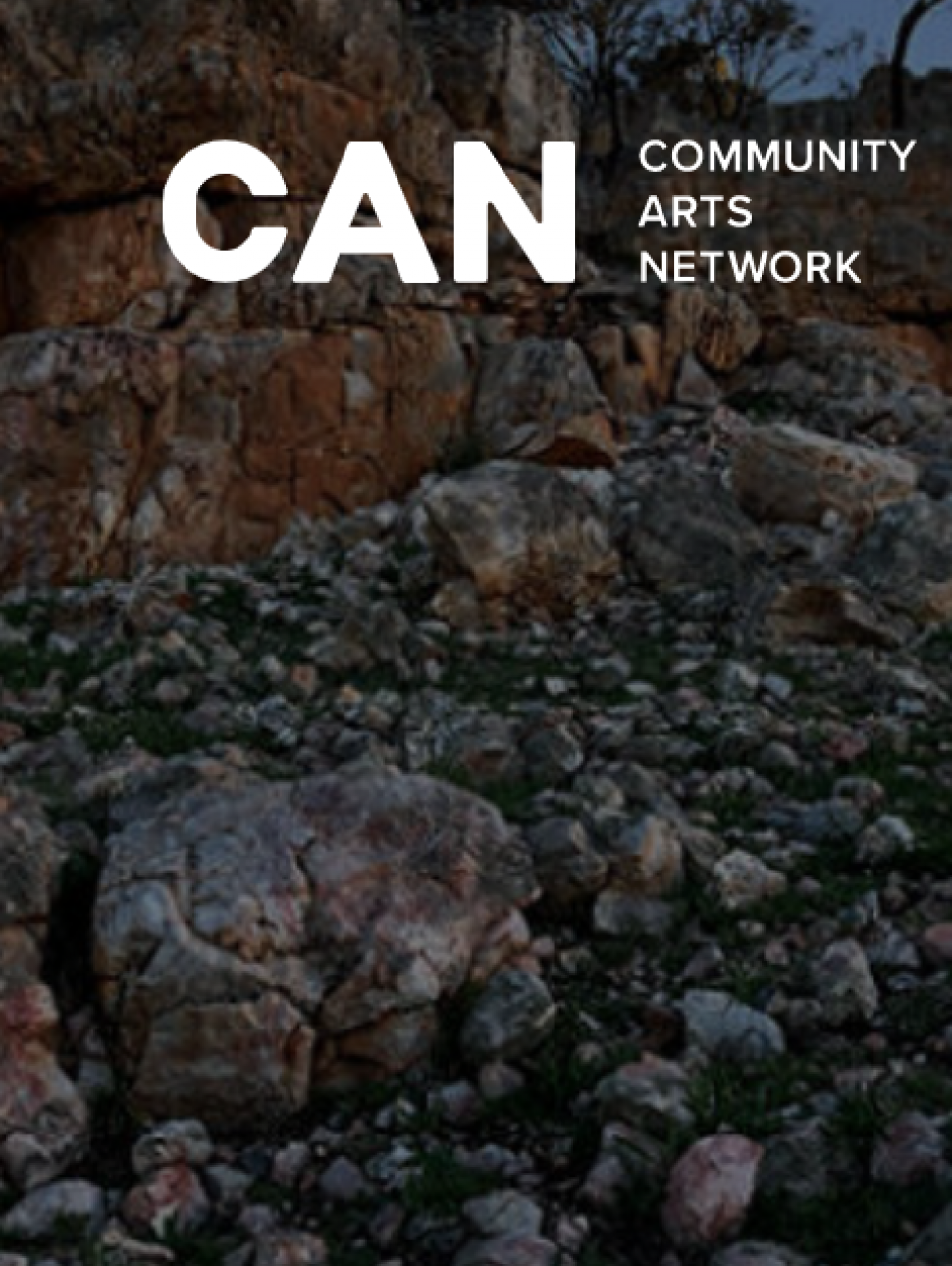 An image of a rocky stretch of ground with the words 'CAN Community Arts Network' over the top