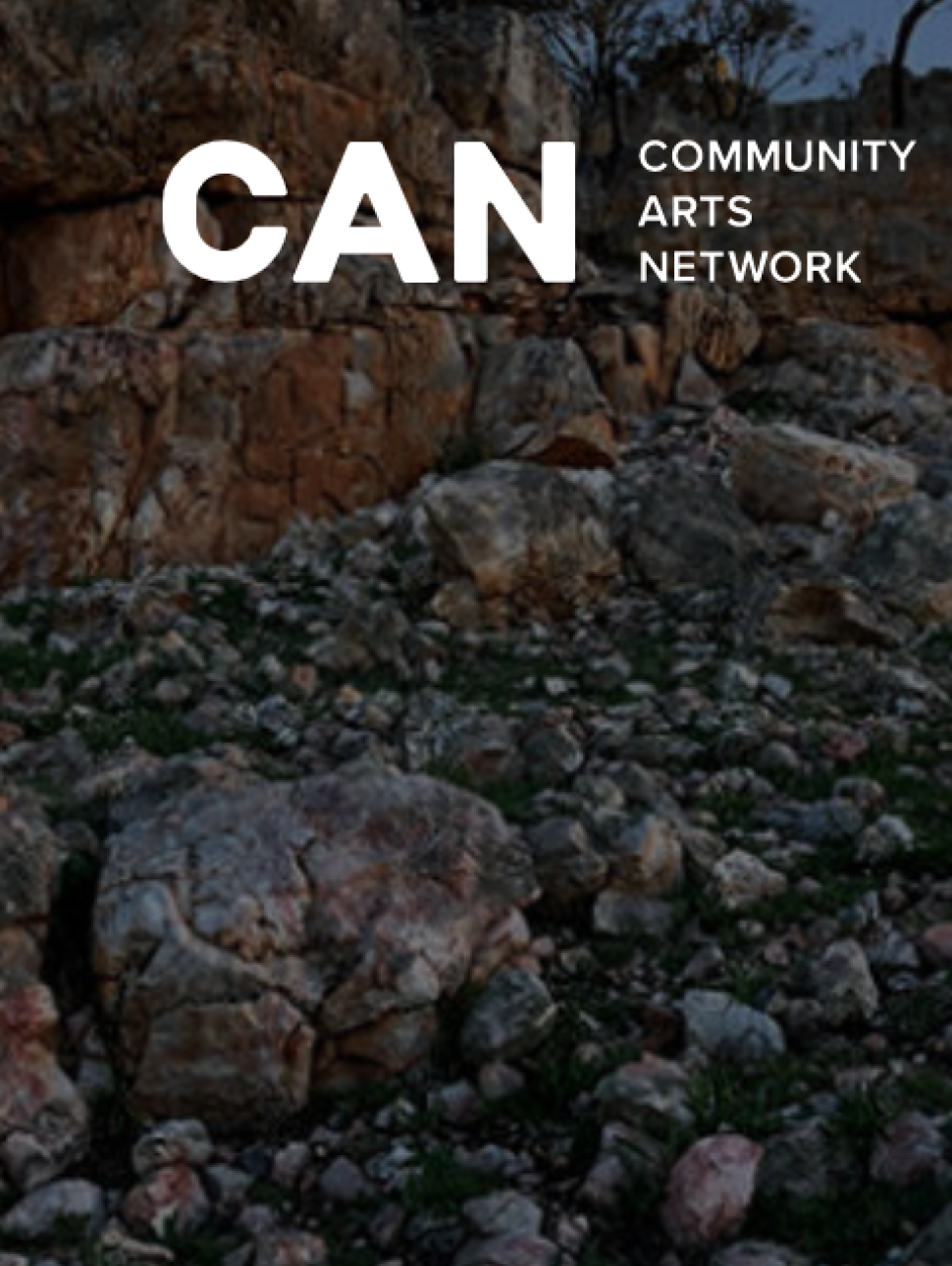 An image of a rocky stretch of ground with the words 'CAN Community Arts Network' over the top 