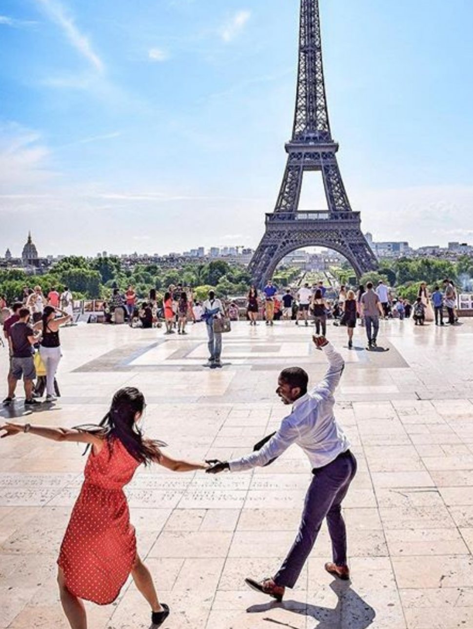 Couple dancing in front of the Eiffel Tower