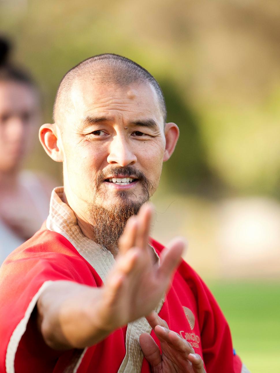 Master practicing Tai Chi in the park