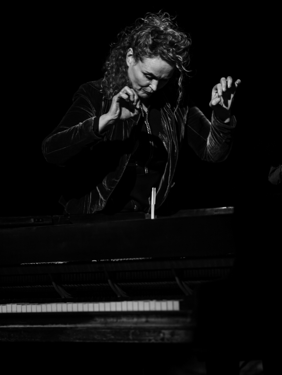 Black and white portrait photo of Gabriella Smart playing the piano