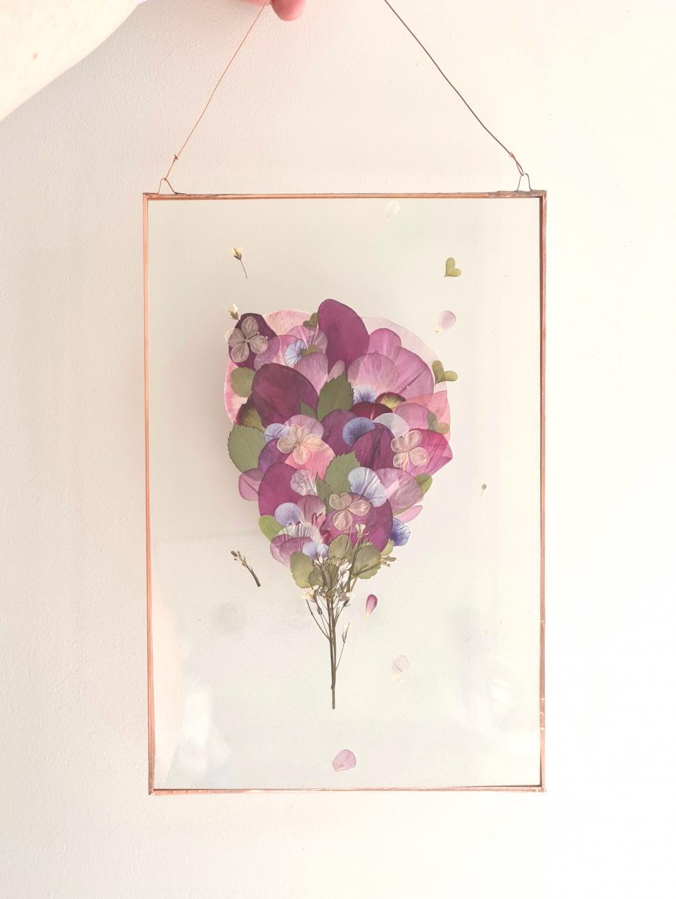 Image of a framed, pressed flower