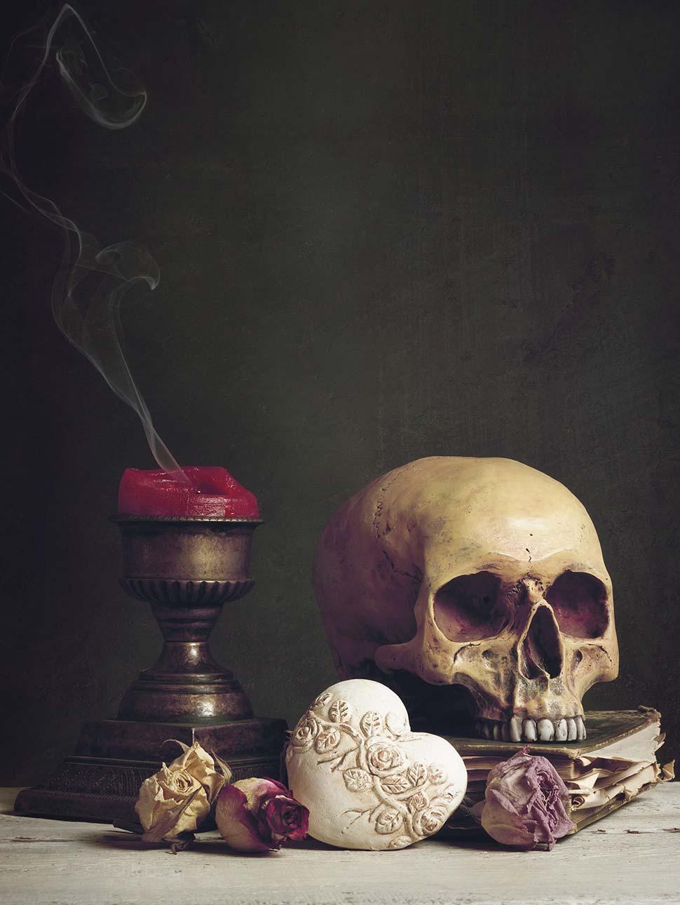 Vanitas with skull, book, candle and heart