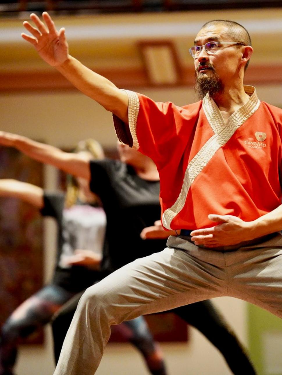 People doing tai chi in Hackett Hall