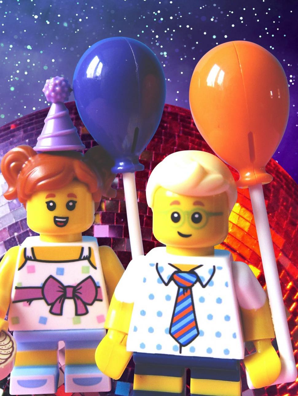 An image of a birthday LEGO minifig character in front of a disco ball 