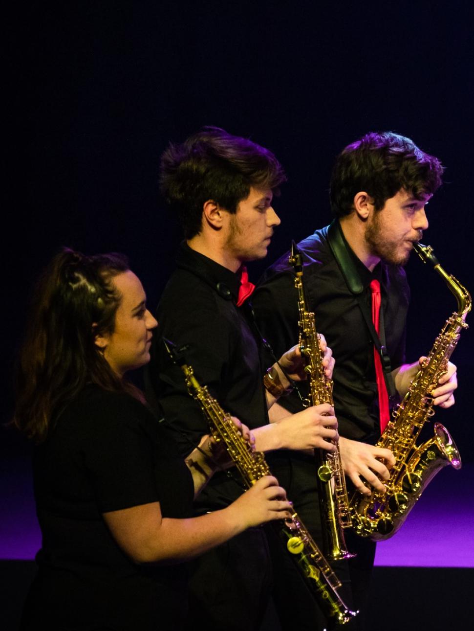 Young people playing saxophone