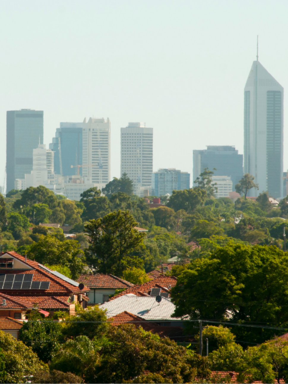 A photograph showing Perth's city skyline and leafy suburb