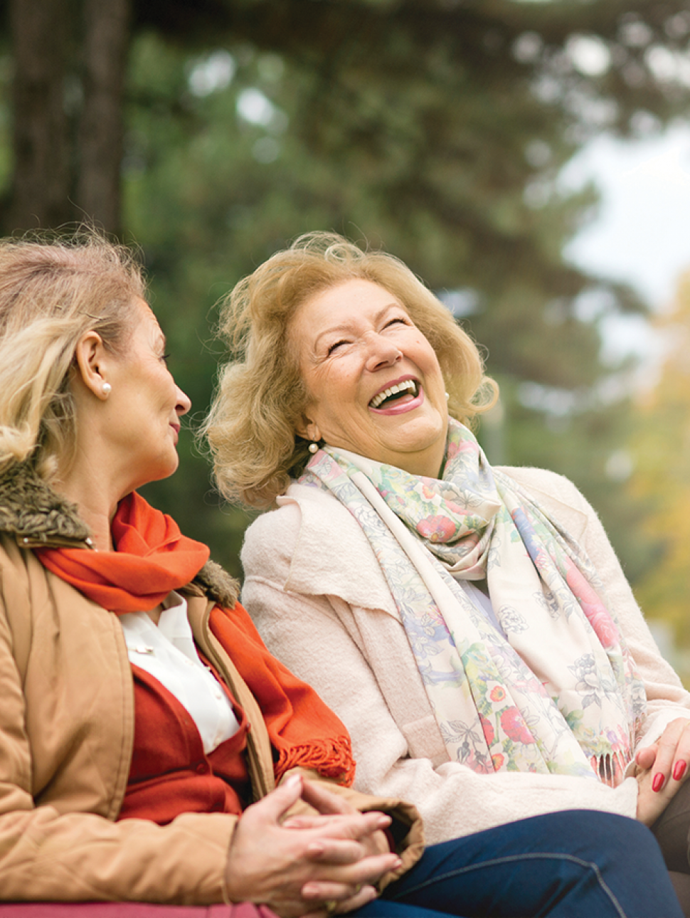 Two women sitting and laughing