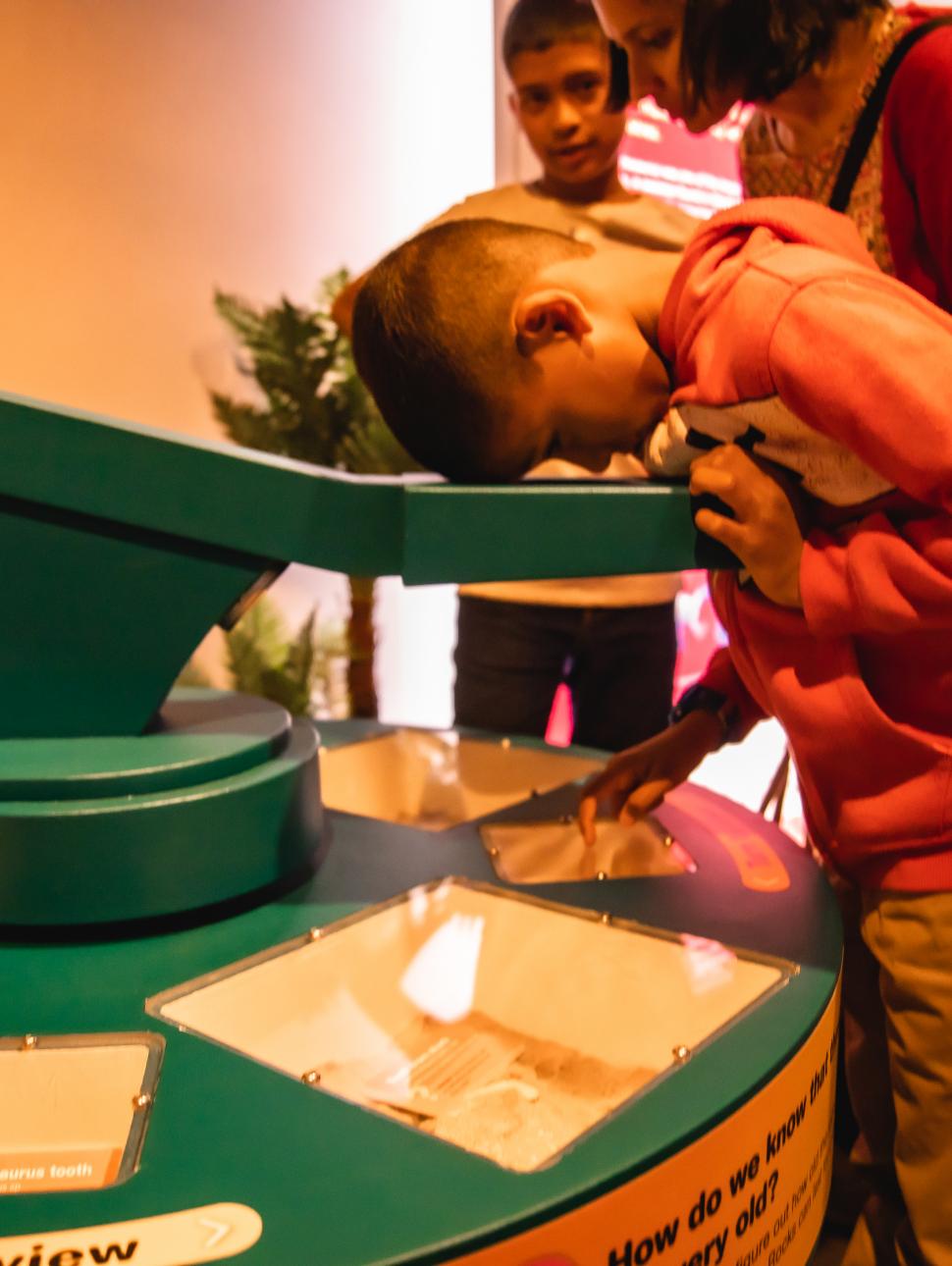 Young child plays with a digital interactive screen