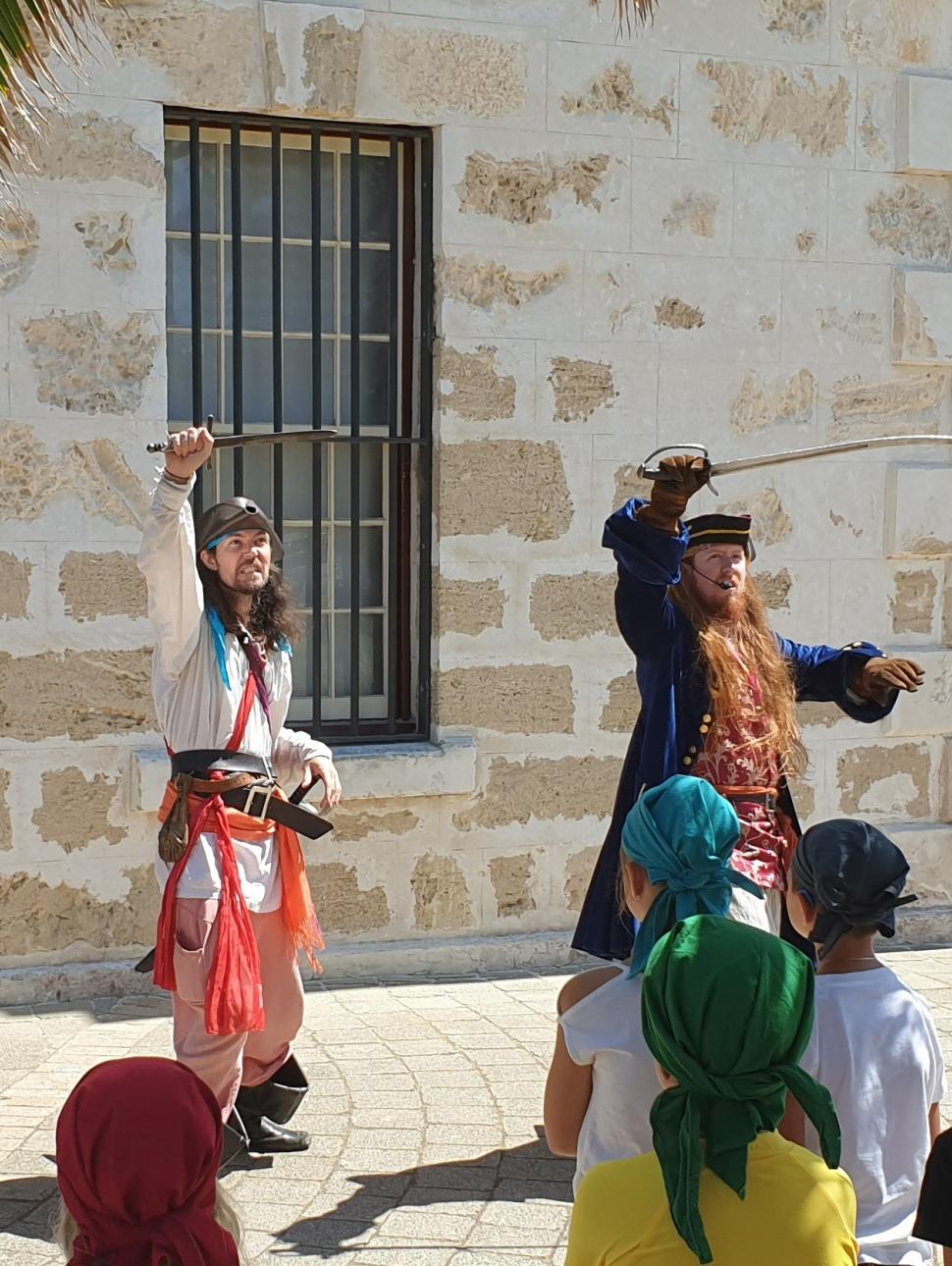 Pirates perform outside Shipwrecks to a young audience