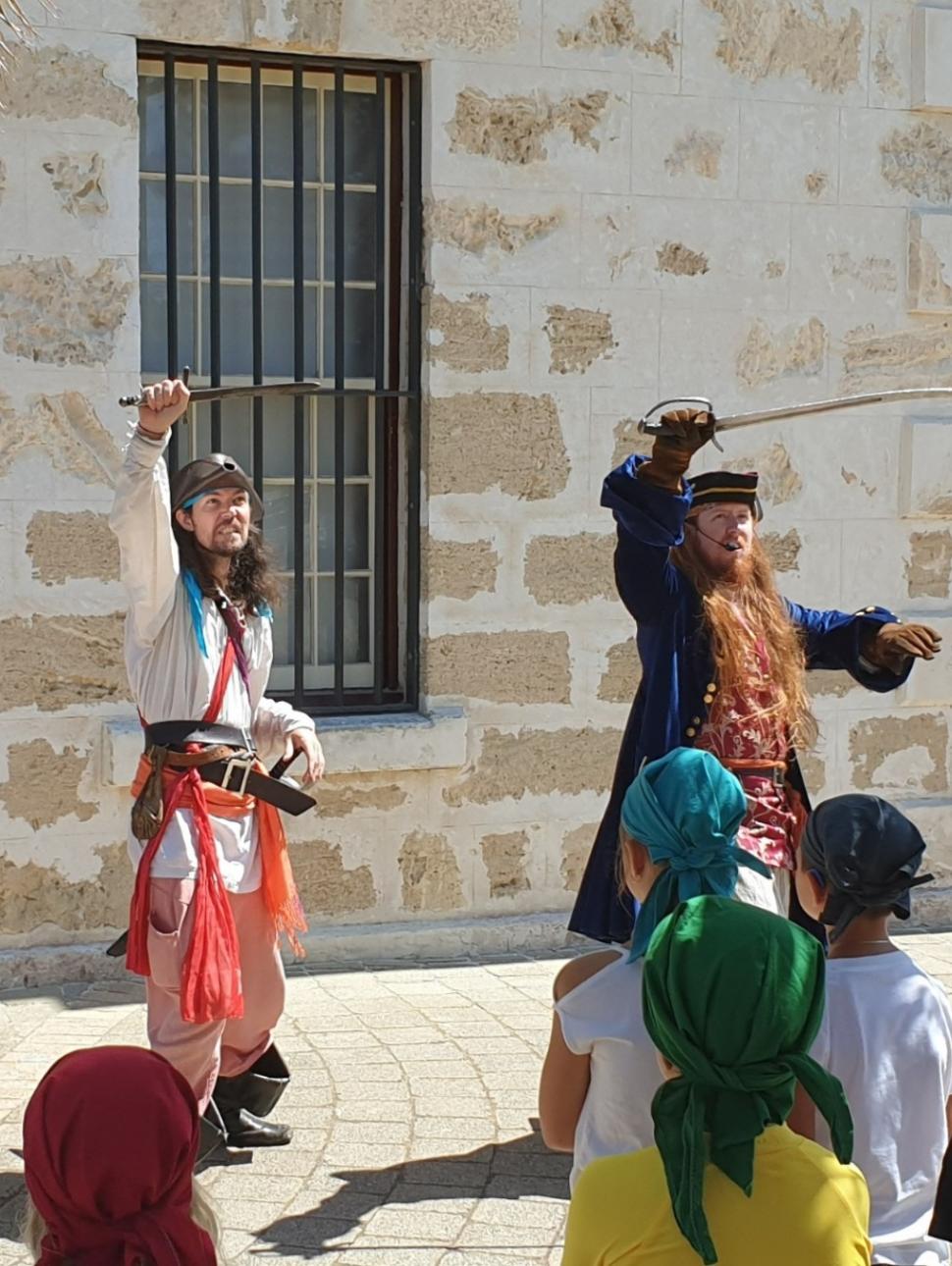 Pirates perform outside Shipwrecks to a young audience