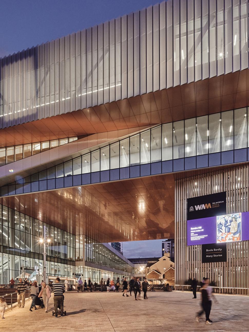 WA Museum Boola Bardip building with a night sky above and people walking