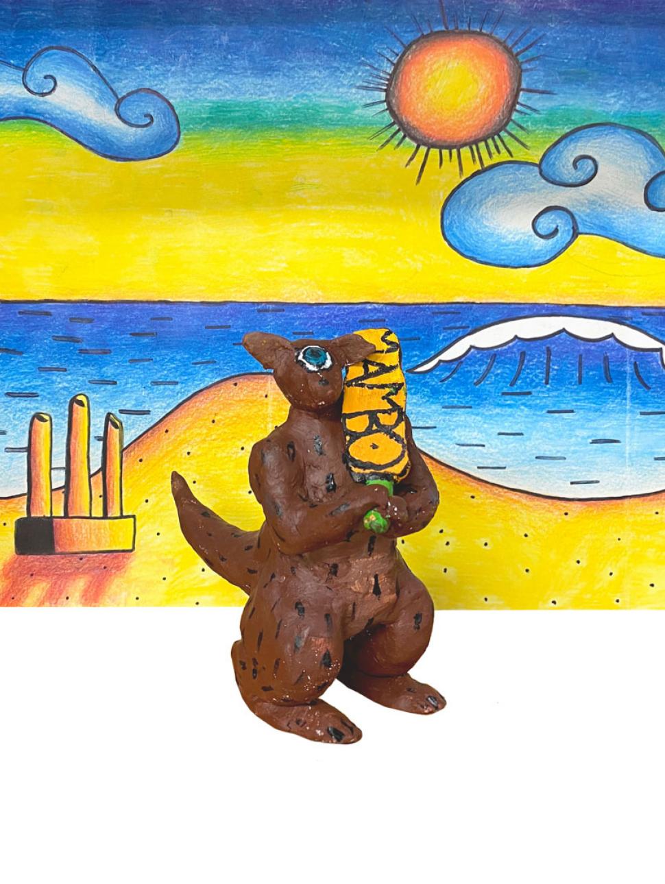 A clay kangaroo holding a cricket bat stands in front of a painted backdrop