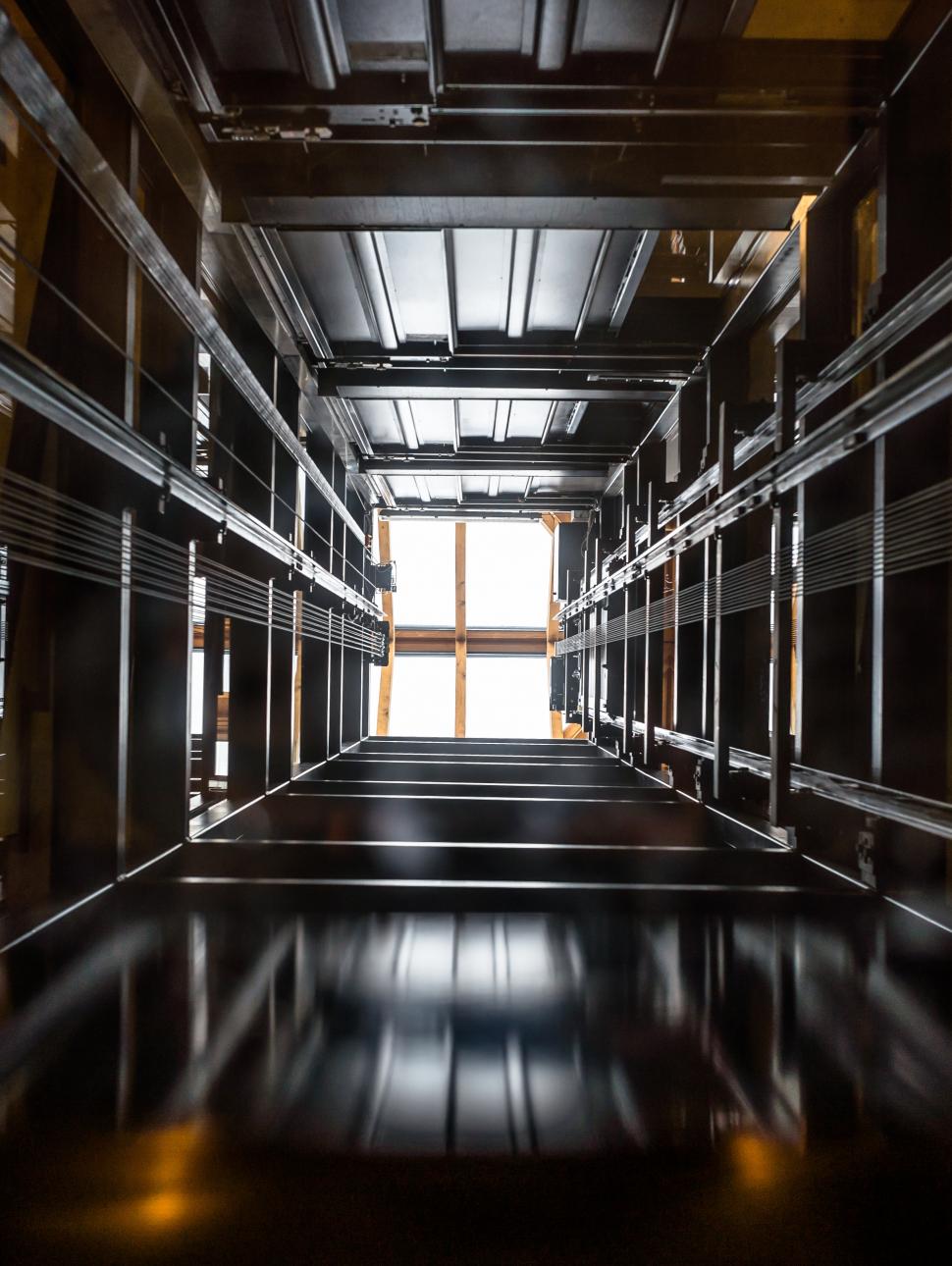 View down into an open elevator shaft